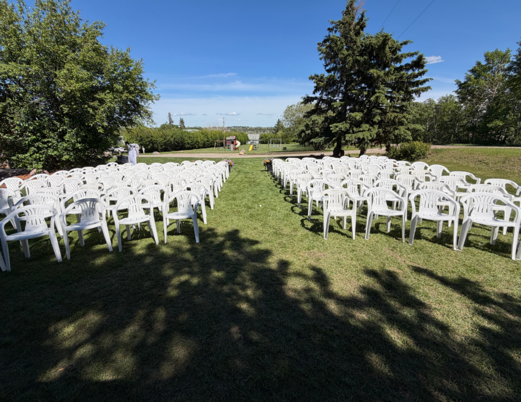 Amy and Kolby's wedding — ceremony on a family acreage, reception at the Bowden Community Hall, Alberta — planned by JK Weddings & Events