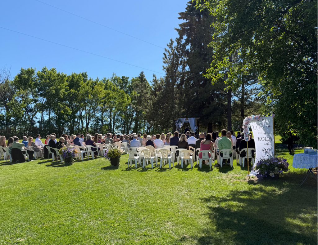 Amy and Kolby's wedding — ceremony on a family acreage, reception at the Bowden Community Hall, Alberta — planned by JK Weddings & Events