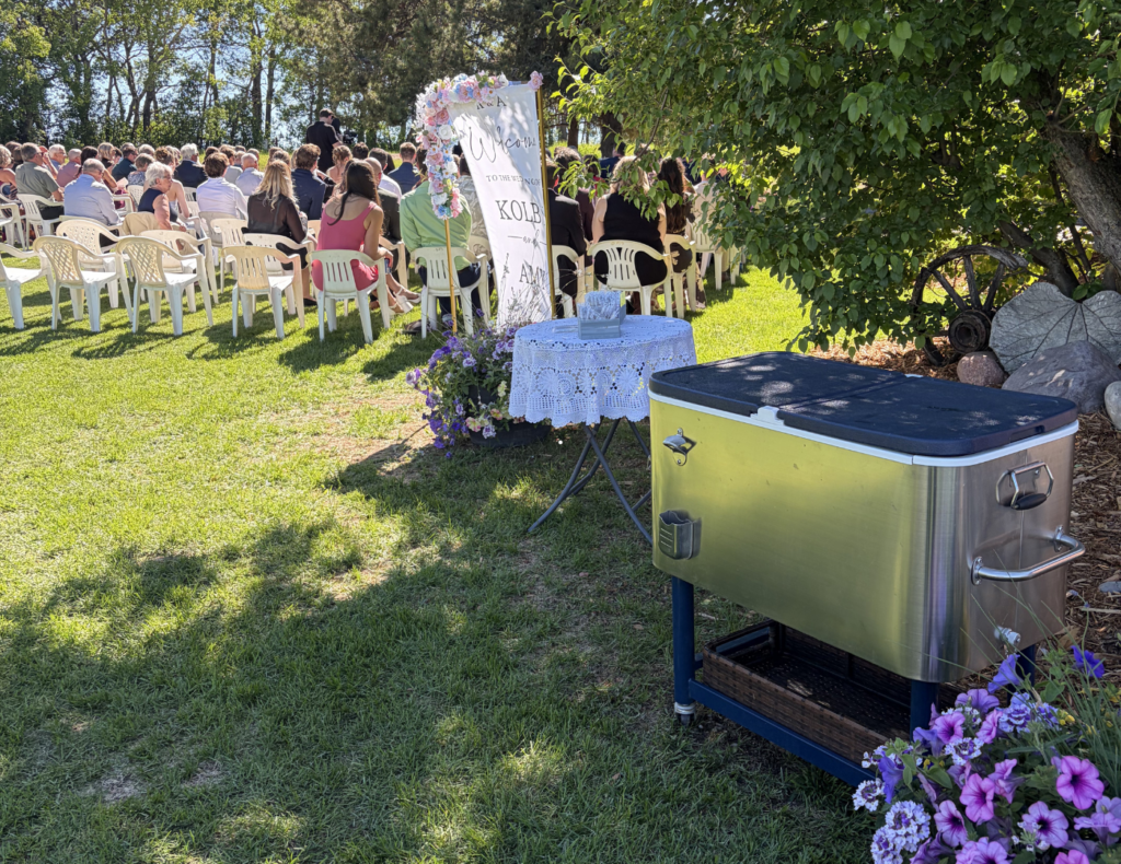 Amy and Kolby's wedding — ceremony on a family acreage, reception at the Bowden Community Hall, Alberta — planned by JK Weddings & Events